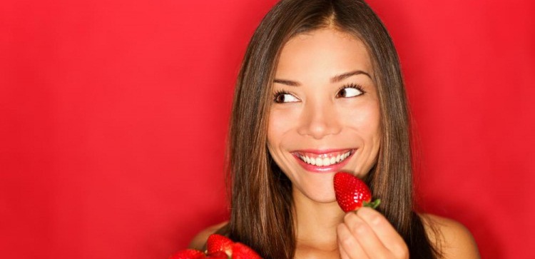 Healthy Snacks For Weight Loss - Woman Eating Strawberry